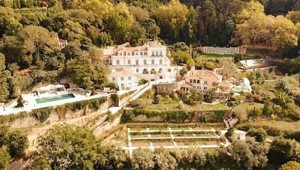Aerial view of the Quinta da Bella Vista estate, villas on the Sintra hillside with the Atlantic beyond