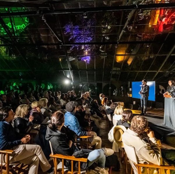 Seated guests inside the Quinta da Bella Vista greenhouse for a ceremony