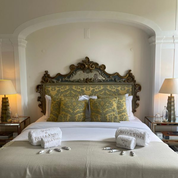 Suite at Quinta da Bella Vista with antique carved headboard and garden light