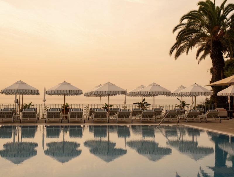 A Madeira clifftop terrace at sunset over the Atlantic on the wedding day