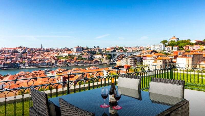 The Yeatman bridge-view terrace set for an intimate alfresco wedding dinner with the Luiz I Bridge over the Douro, Vila Nova de Gaia, Porto